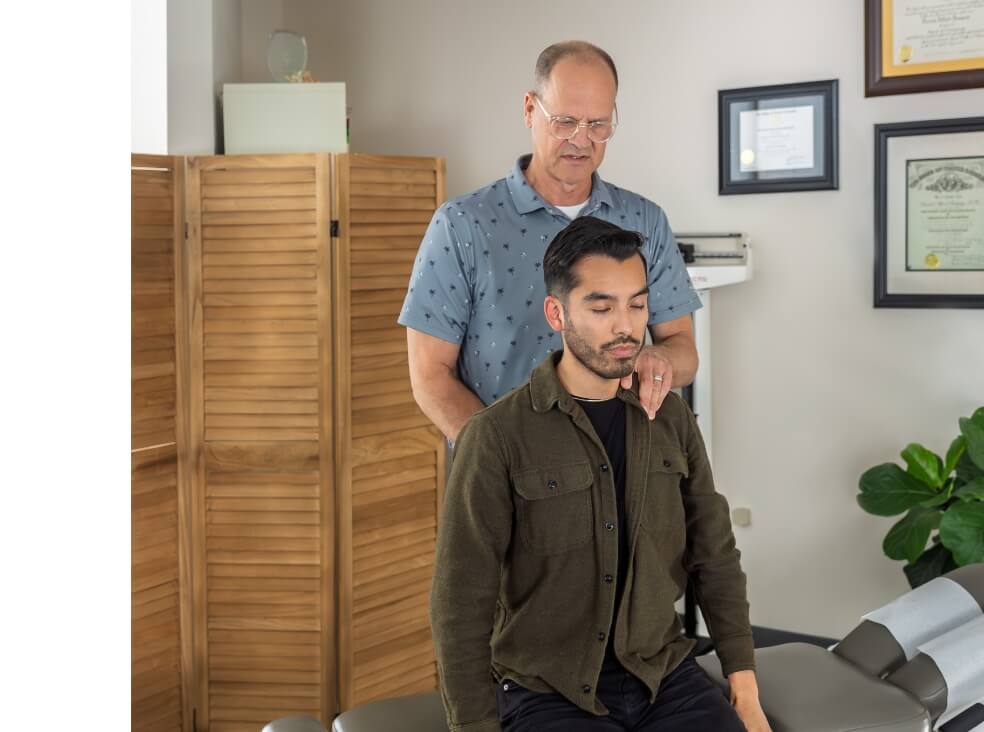 doctor adjusting patient