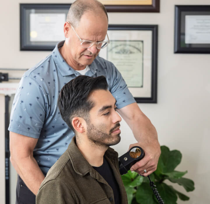 Dr. Dempsey checking patient