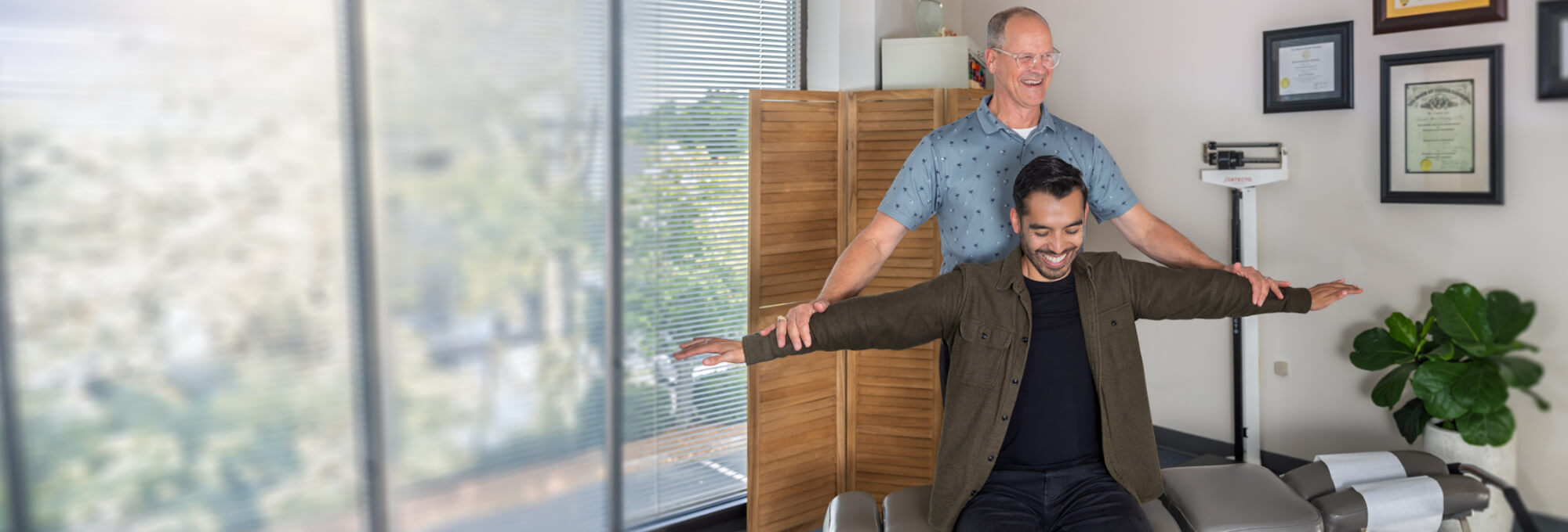 doctor adjusting patient