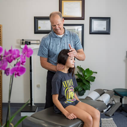 Adjusting patient's neck