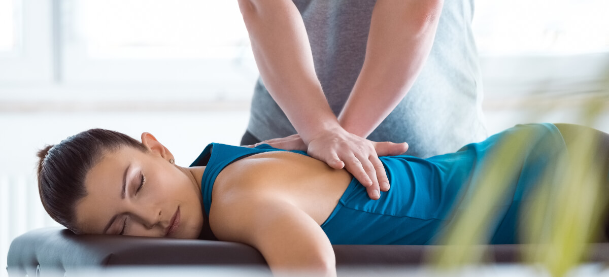 Female patient receiving a chiropractic adjustment