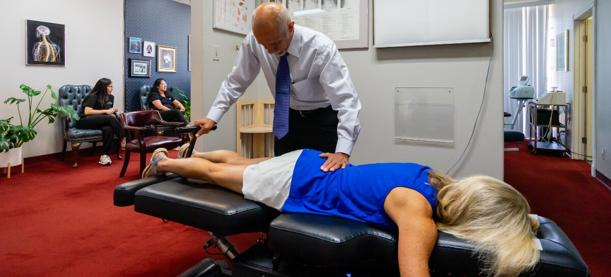 Female patient receiving a chiropractic adjustment
