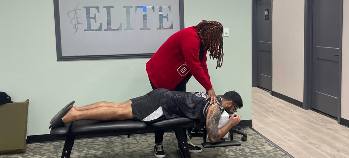 Patient receiving chiropractic adjustment at Elite Chiropractic & Therapy