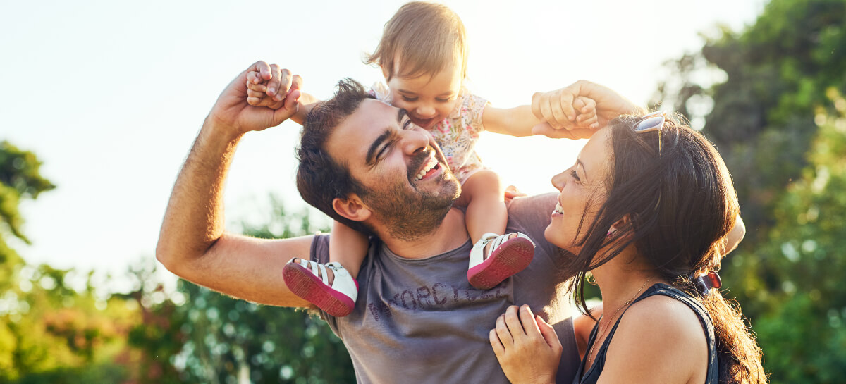 Smiling mom, dad and infant