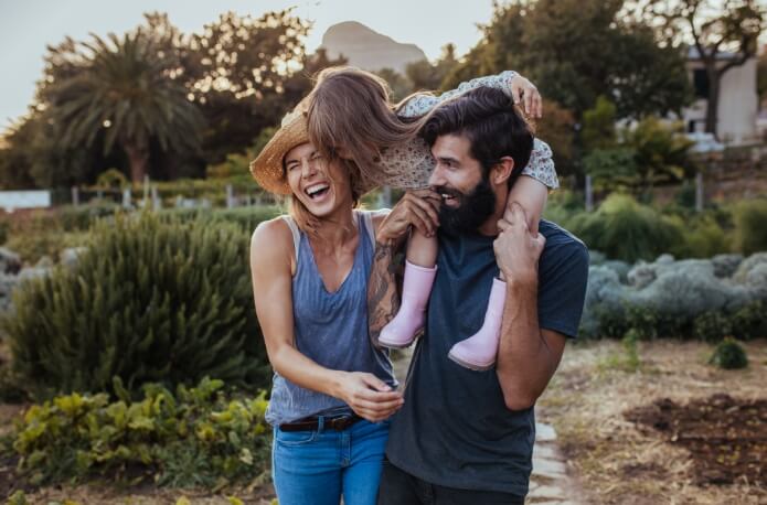 Smiling family of three