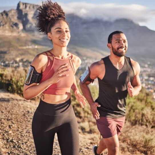 Athletic man and woman jogging