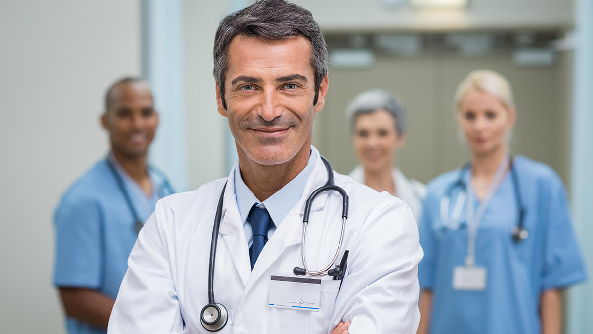 Doctors with staff at the back