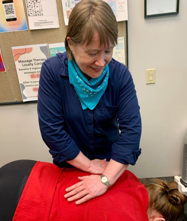 Chiropractor doing back adjustment