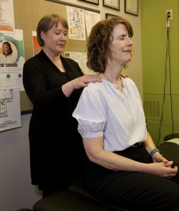 Chiropractor doing back adjustment