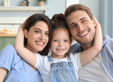 family of three smiling
