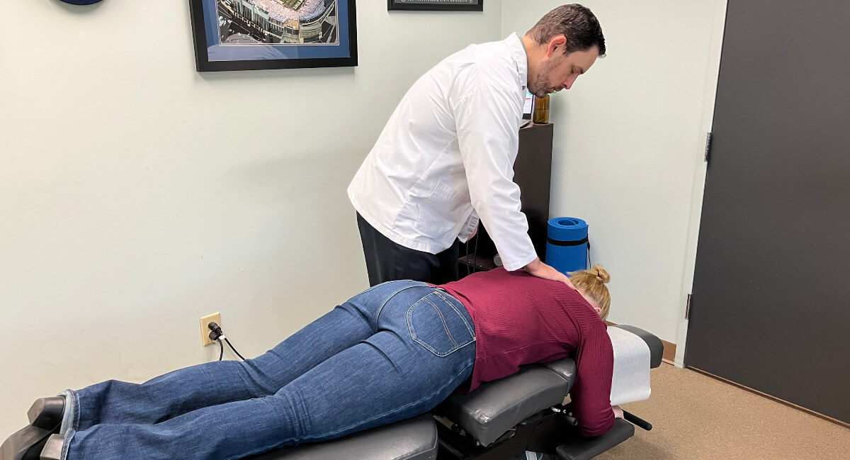 Chapel Hill chiropractor adjusting patient's neck