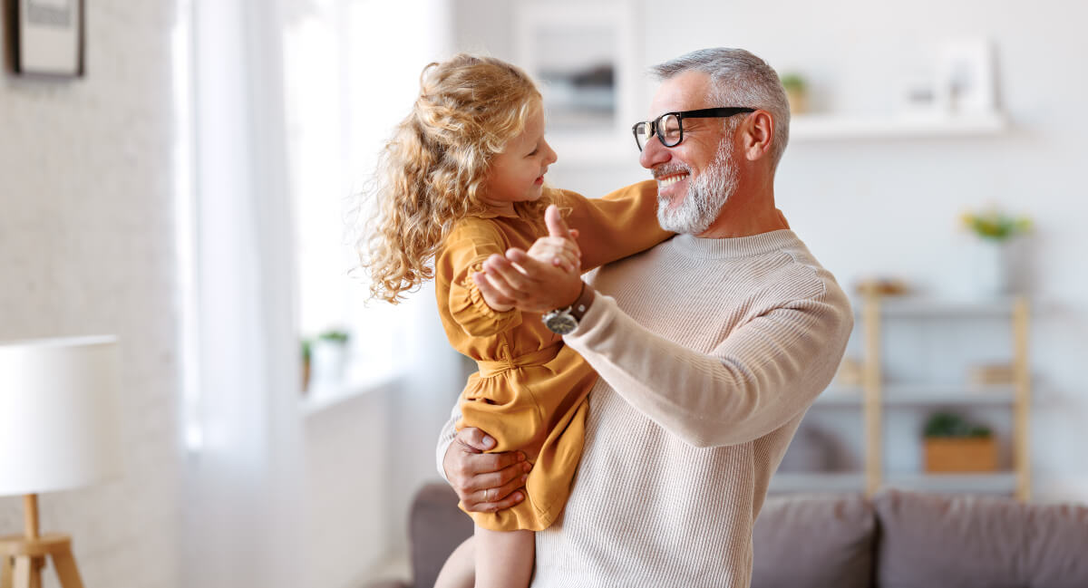Grandpa and granddaughter dancing