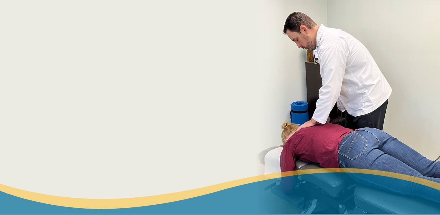 chiropractor adjusting patient