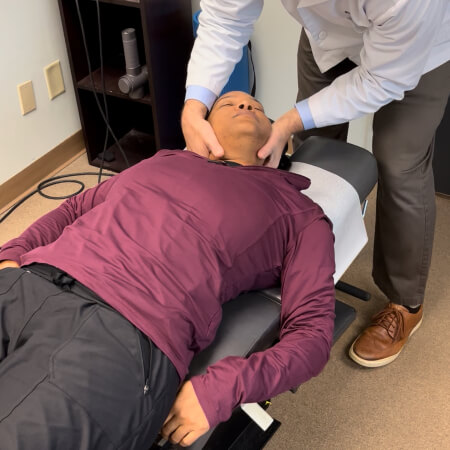 Chapel Hill patient getting her neck adjusted
