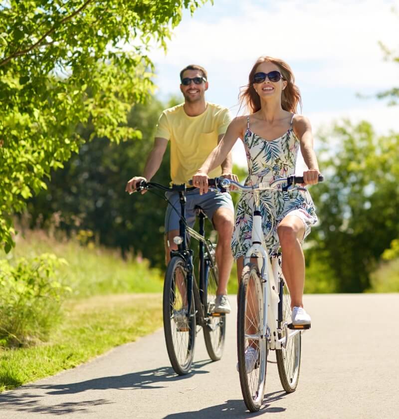 Active young couple out for a bike ride