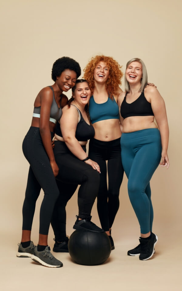 Group of smiling women in a gym