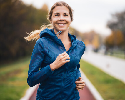 Smiling running female athlete