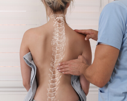 Female patient with spine illustration on back