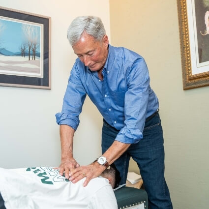 Dr Dale adjusting patient