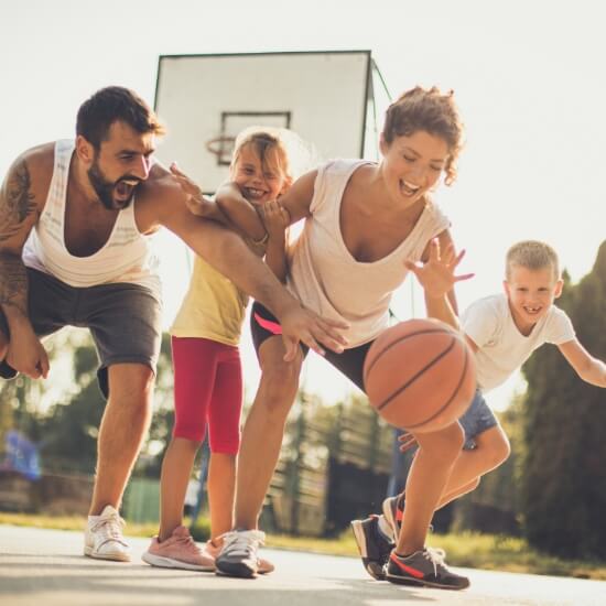 family of 4 playing basketball