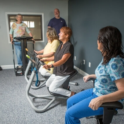 our team assisting patients on machines