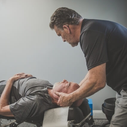 Advantage Chiropractic  patient having neck adjusted