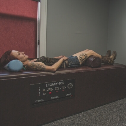 person laying on decompression table