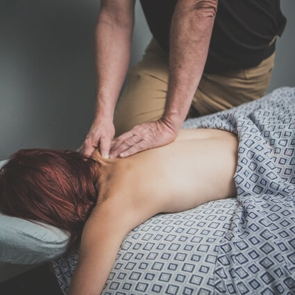 Advantage Chiropractic  patient having back massaged