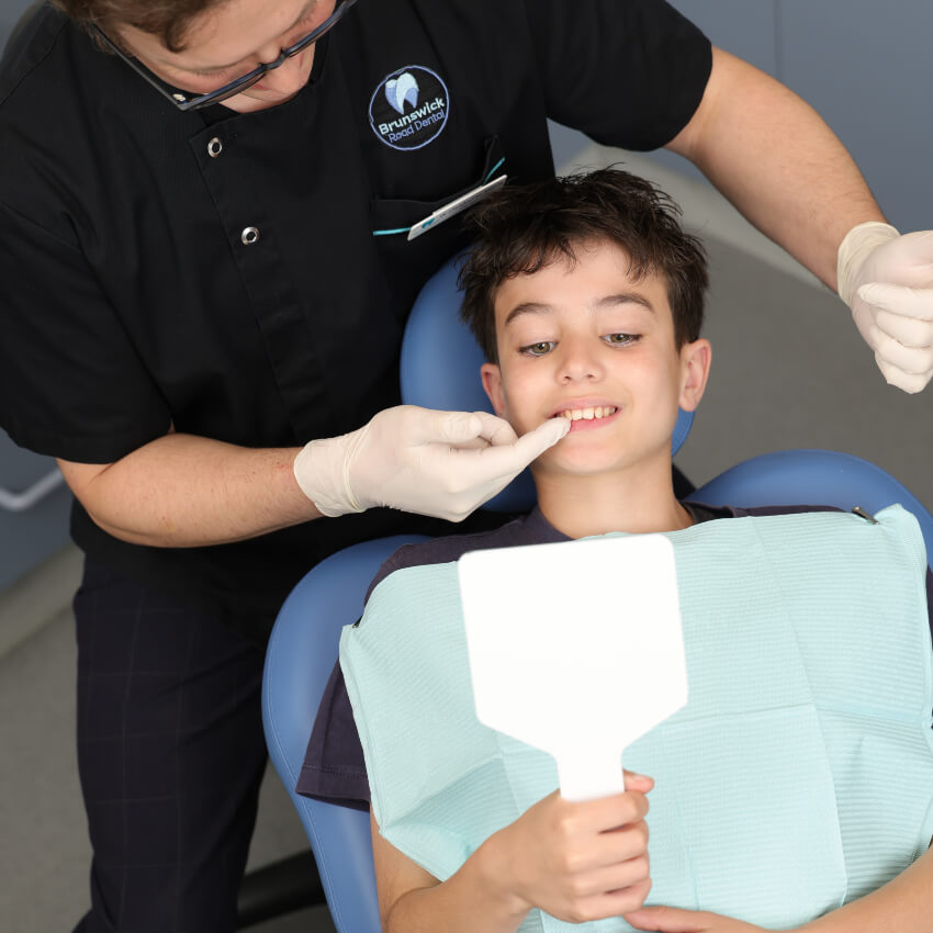 Brunswick dentist Dr Chris during a children's exam