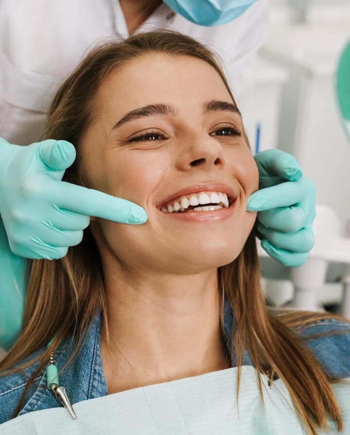 patient smiling in dental chair