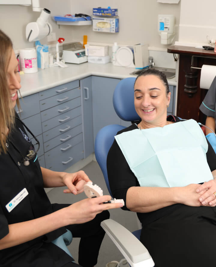 patient smiling in dental chair