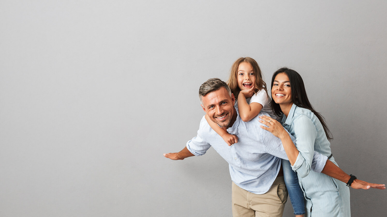 family of three smiling
