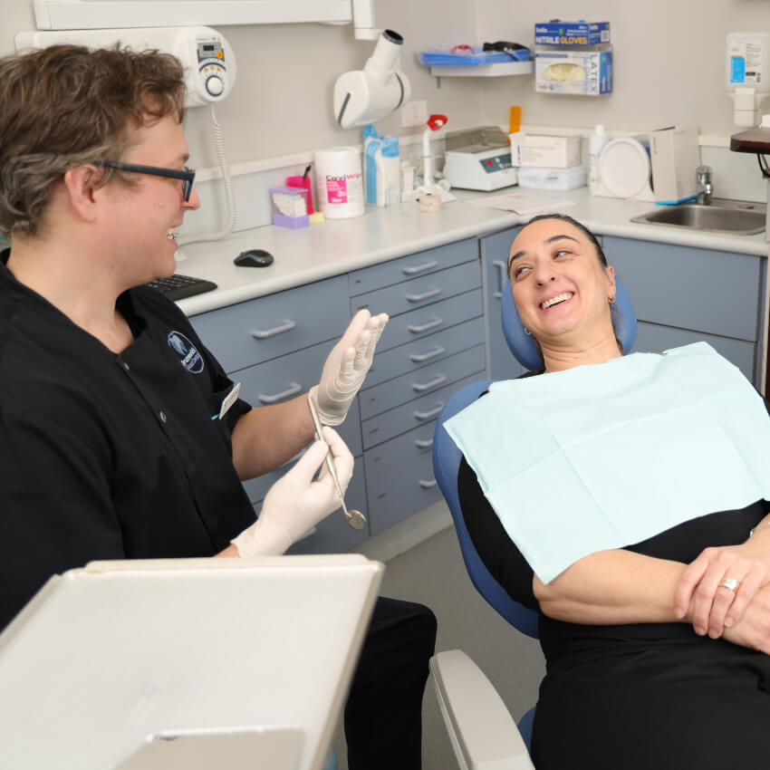 Brunswick dentist Dr Chris talking with a patient