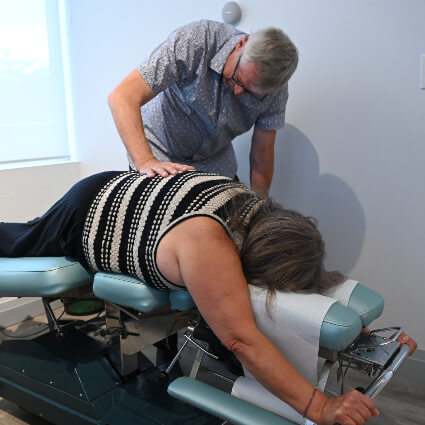 Pressing on patient's back