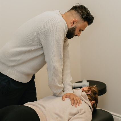 Dr. Arjun upper back adjustment