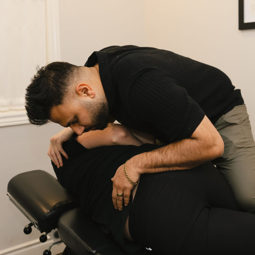 Dr Bali performing a lumbar spine adjustment for degenerative disc disease