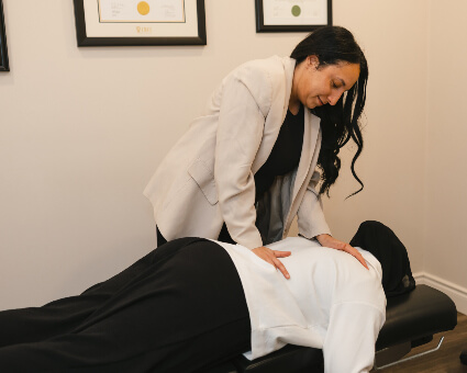 Adjusting woman's back