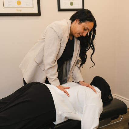 Dr Jessica adjusting female patient