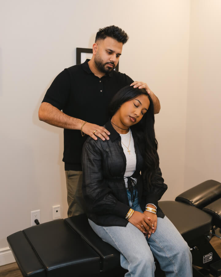 London Chiropractor Dr Bali adjusting patient