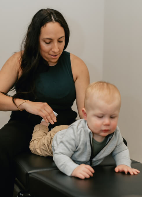 Dr. Jessica adjusting baby