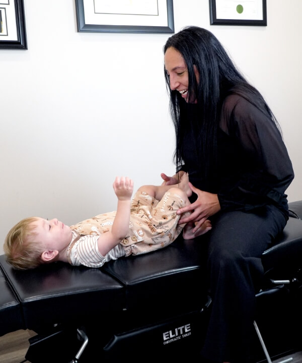Dr. Jess adjusting kid patient