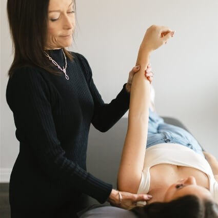 melissa working with patients arm