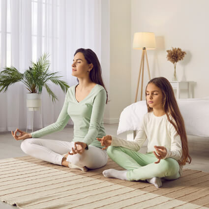 mother and daughter breathing