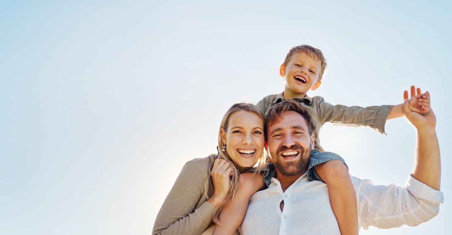 Smiling family of three