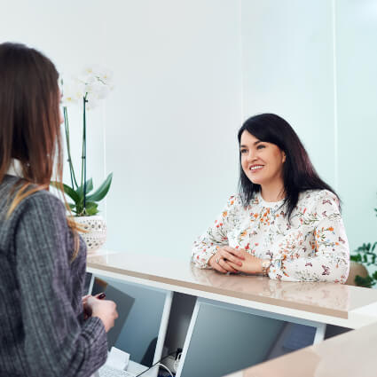 Woman checking in at reception