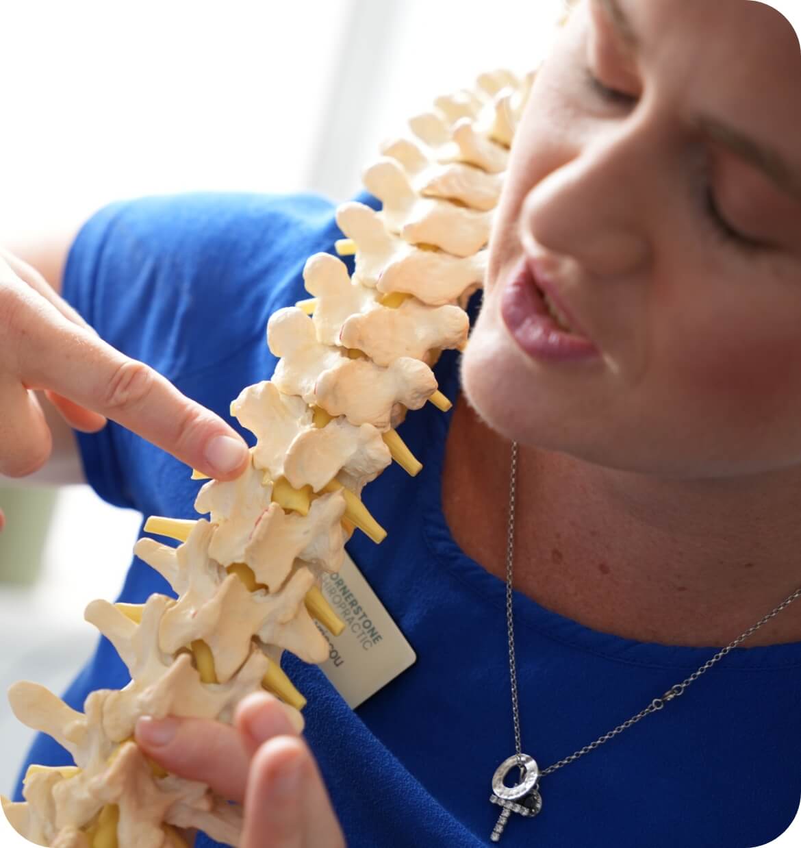 Eastbourne chiropractor adjusting male patient's upper-back