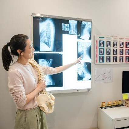 Dr Irene showing xrays to patient