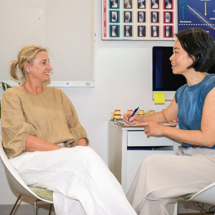 Dr Irene talking with a patient