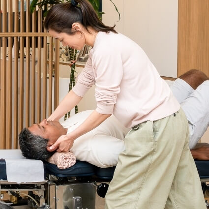 Dr Jane adjusting patients neck