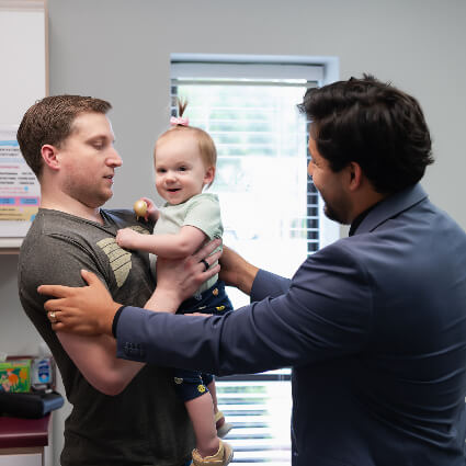 Dr. Garcia with dad and baby